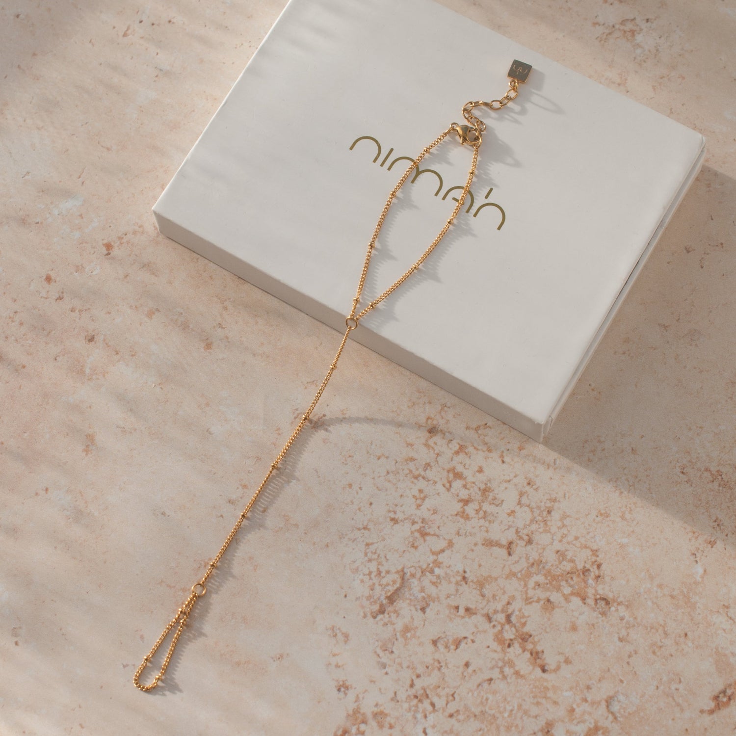 hand chain gold by Nimah dotted