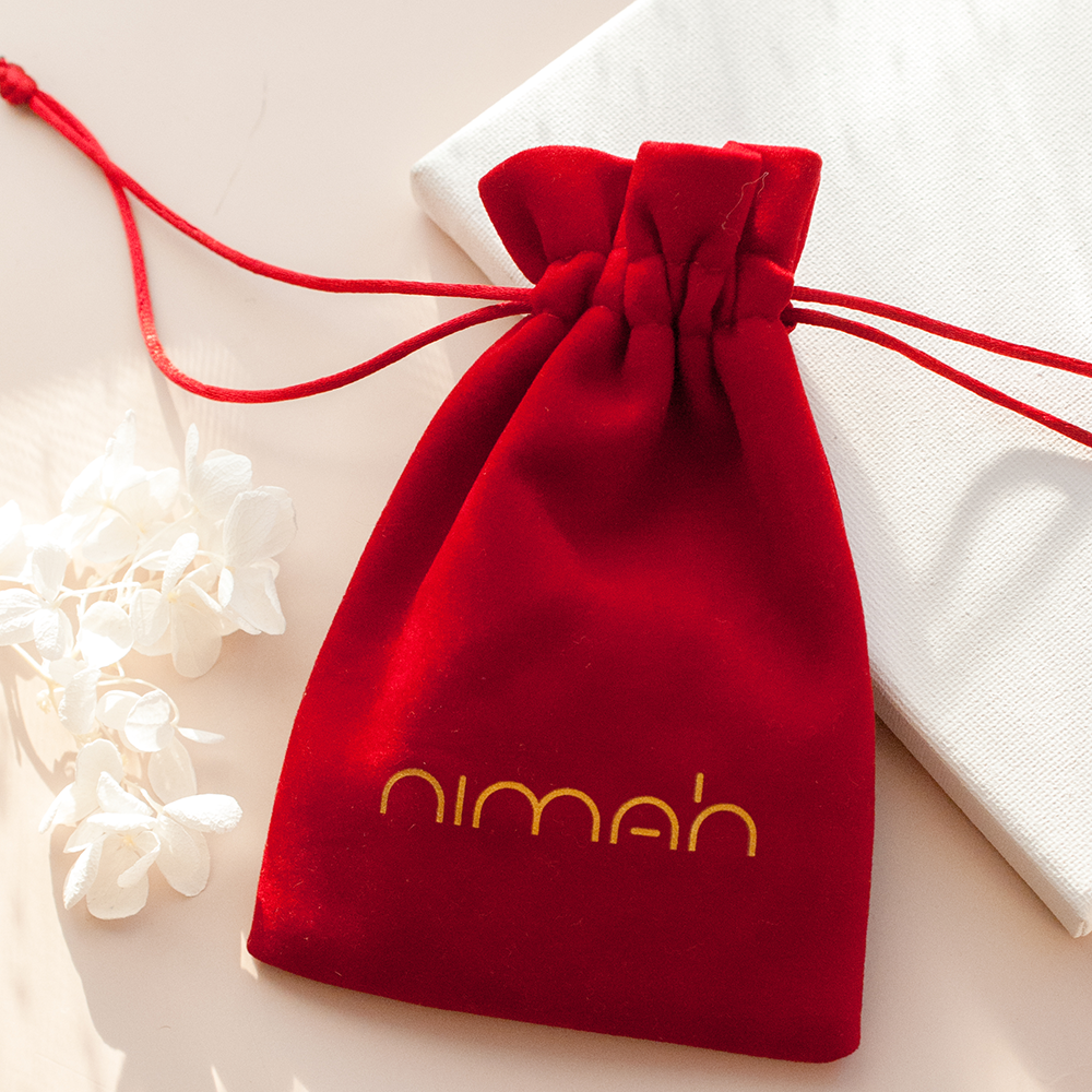 Red velvet jewellery pouch by Nimah London