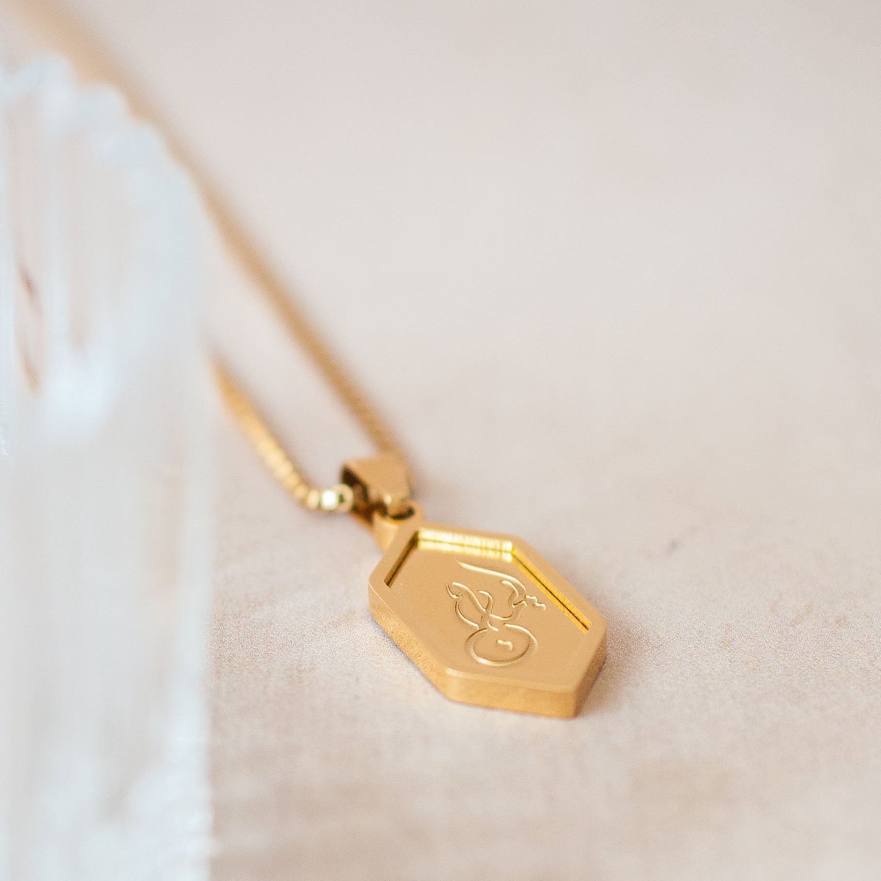 Close Up Of Nimah "Faith" Arabic Necklace With 18K Gold Plating & Arabic Calligraphy