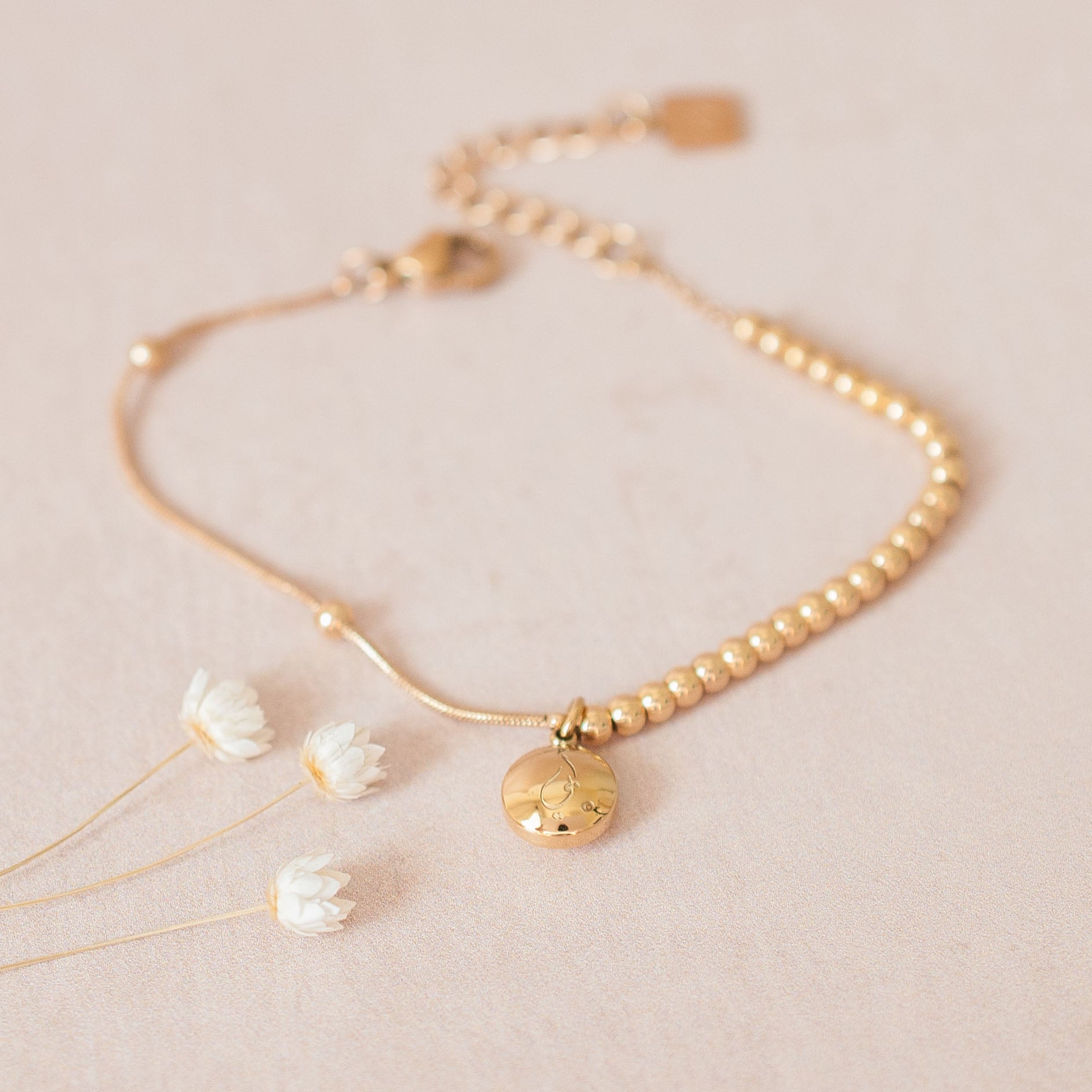 Half chain and half beaded islamic bracelet in gold with 'Father' engraved