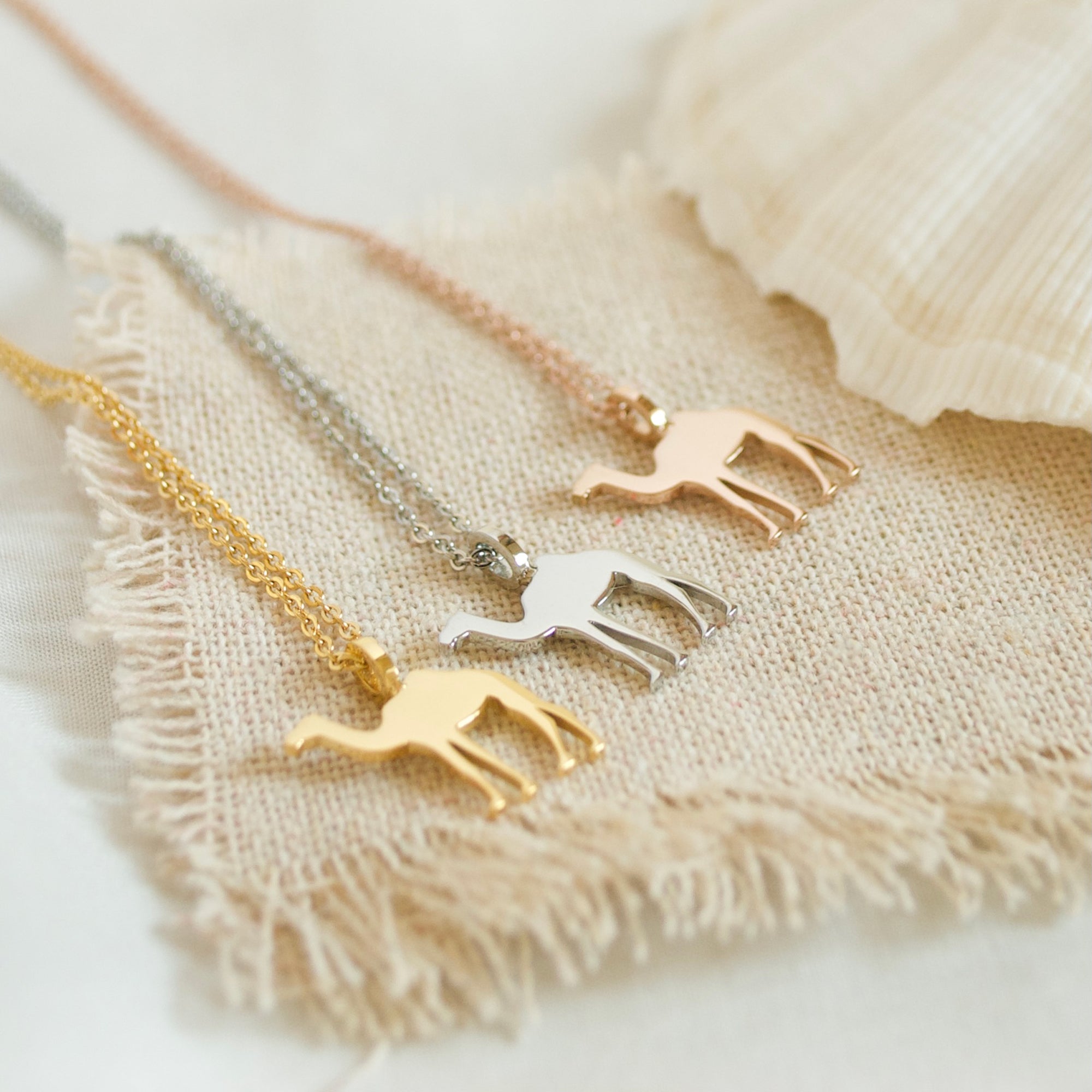 image of gold, rose gold and silver camel necklace