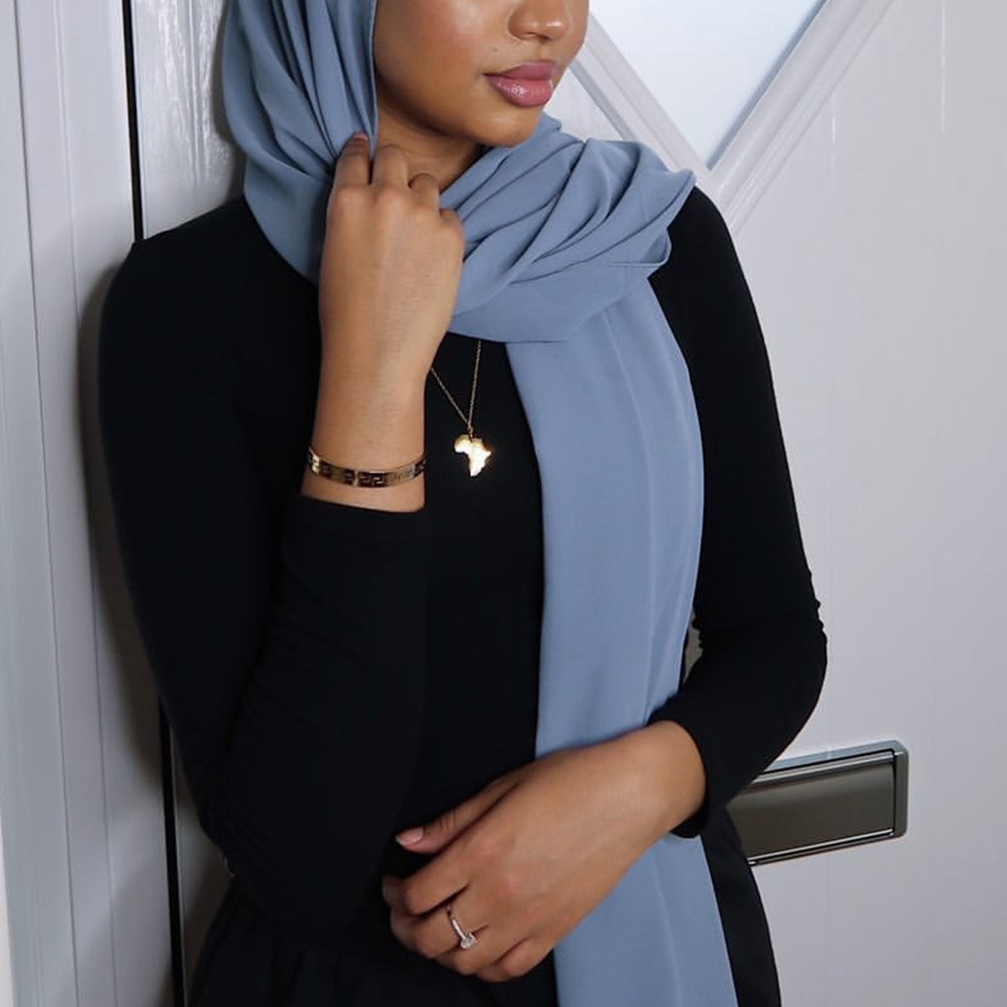 model wearing Africa map arabic necklace mama africa necklace 