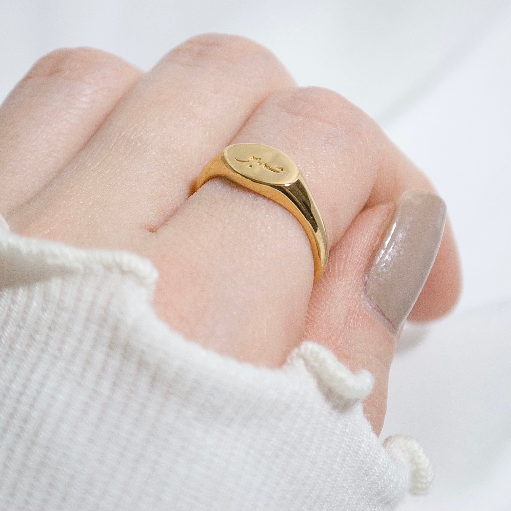 Close-up of the Patience Ring on a woman's finger, a symbol of resilience and faith in Islam
