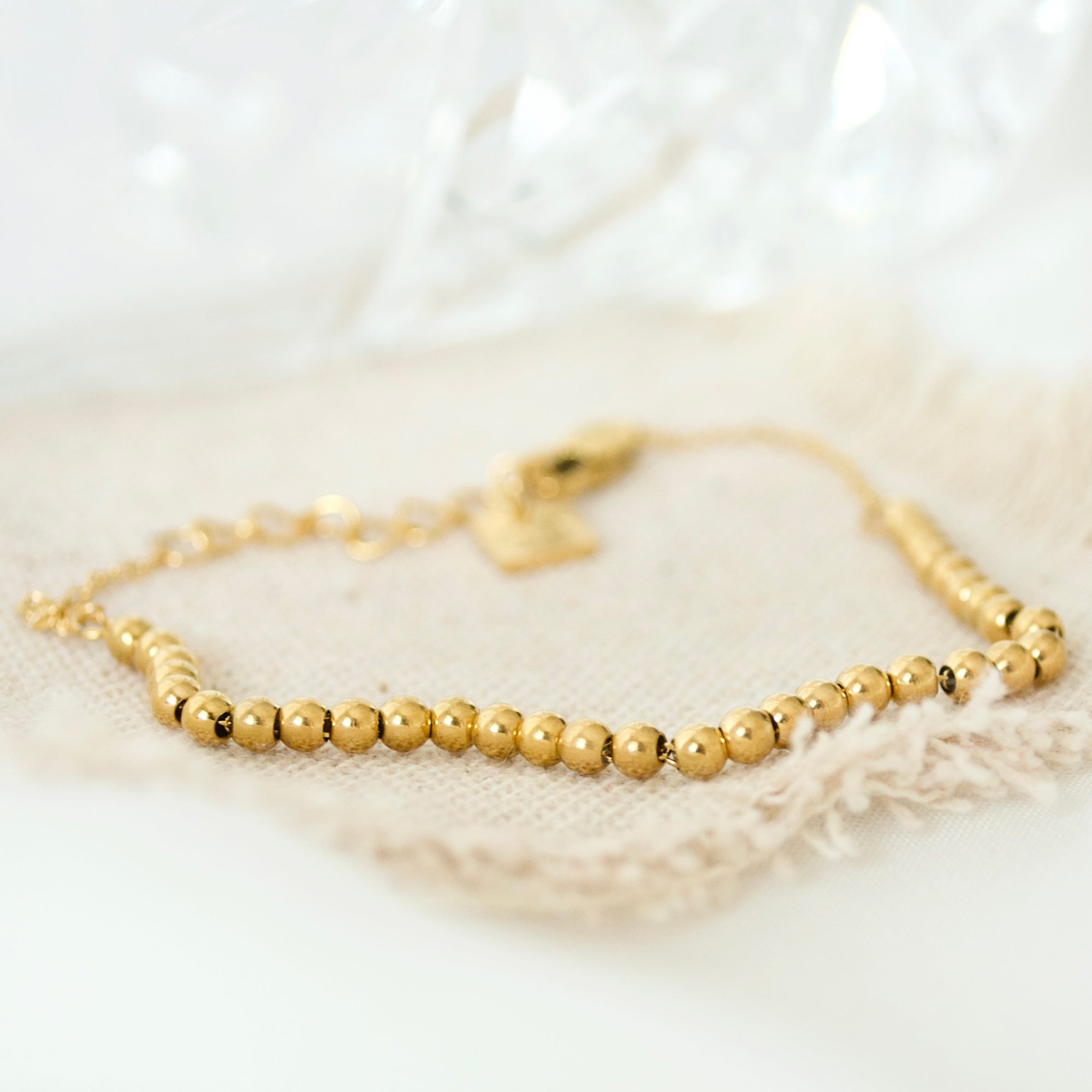 Close up of Niamh London's beaded Arabic gold bracelet