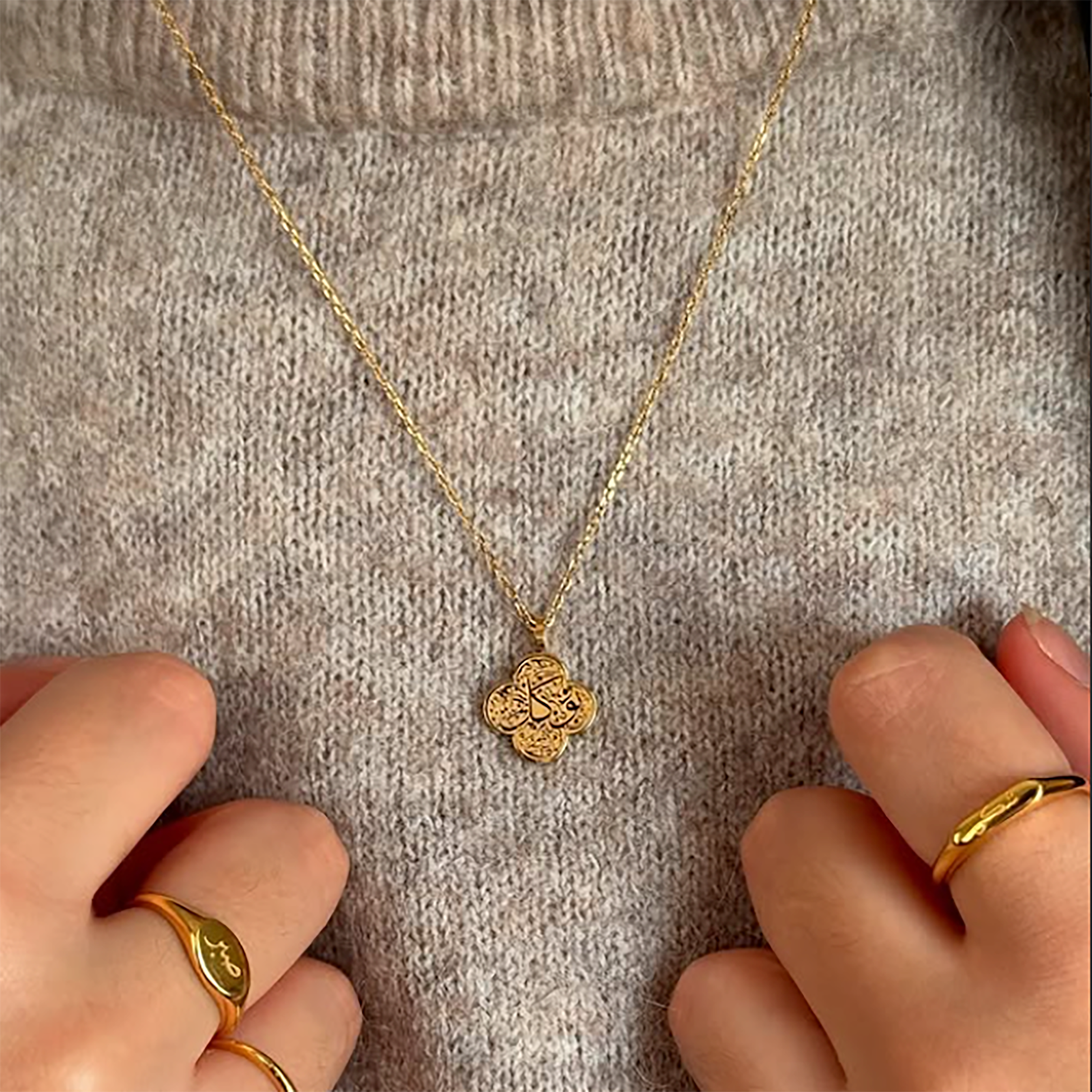 Tawakkul clover Gold necklace with a worn by model 