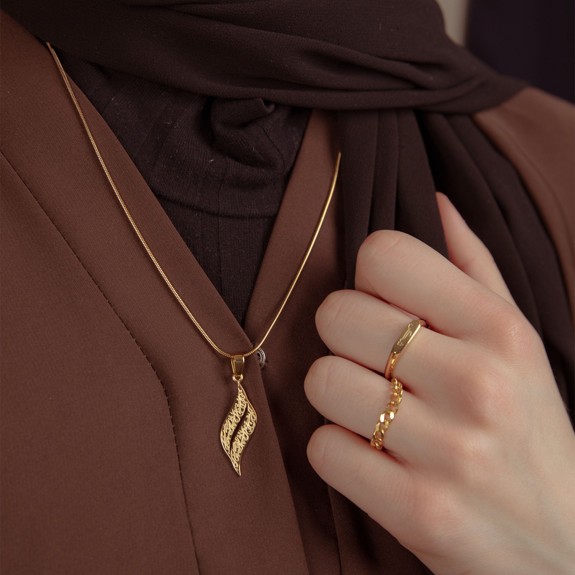 Nimah "With Hardship Ease" Gold  Plated Arabic Necklace Worn By Woman in An Abaya